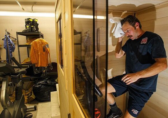 detox-chambe Man using sauna in workout room.